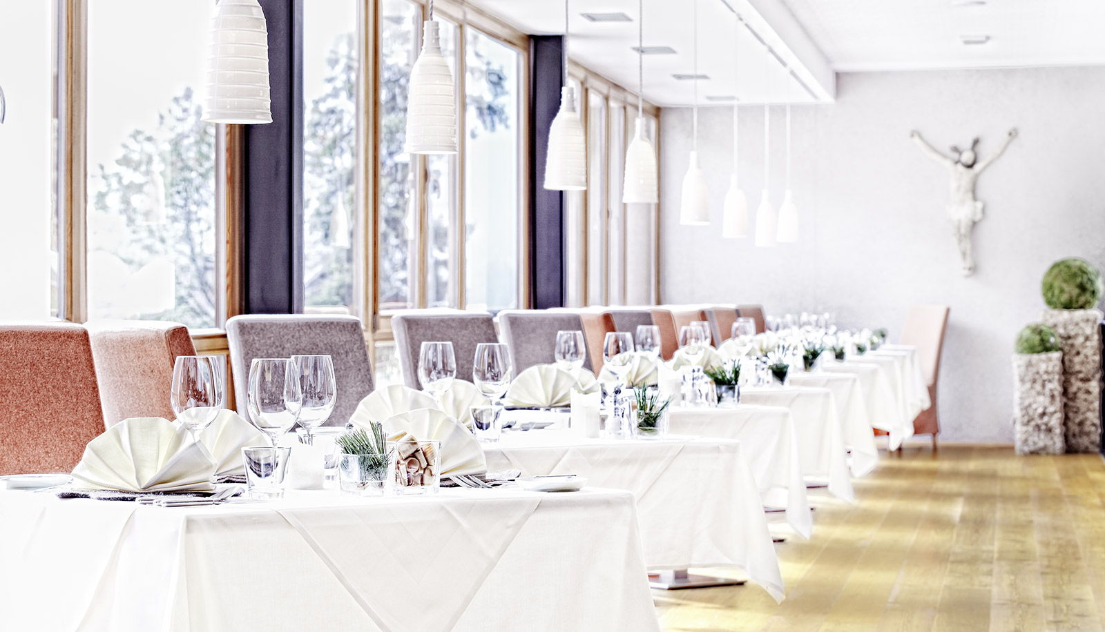 Set tables in the dining room of Arosea Life Balance Hotel in Ultental-Val d'Ultimo